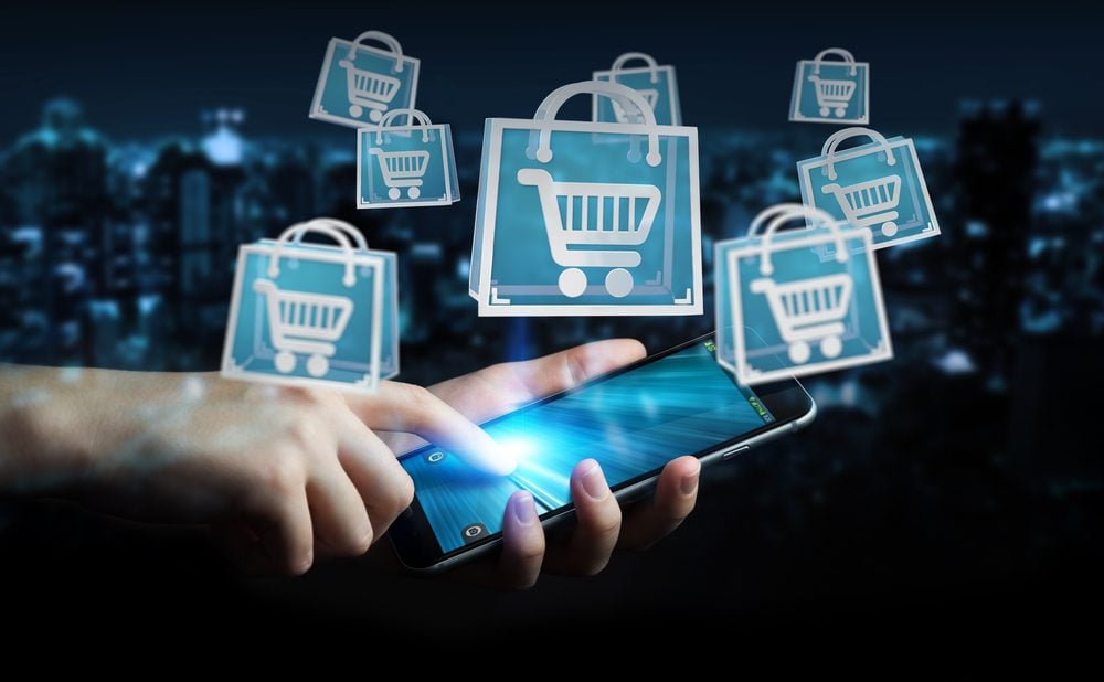 Businessman using digital shopping icons